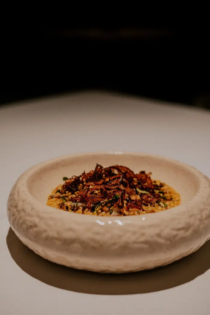 Lamb with dalia and sprouted moong in a textured bowl