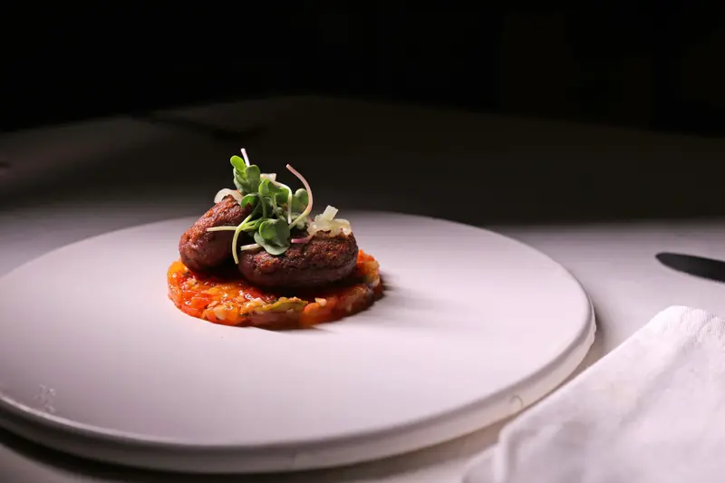 Lotus stem patty on a white plate