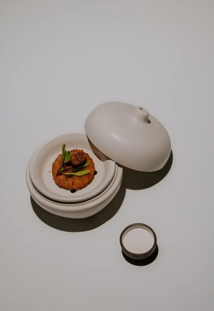 Crisp pithore served in a covered ceramic bowl
